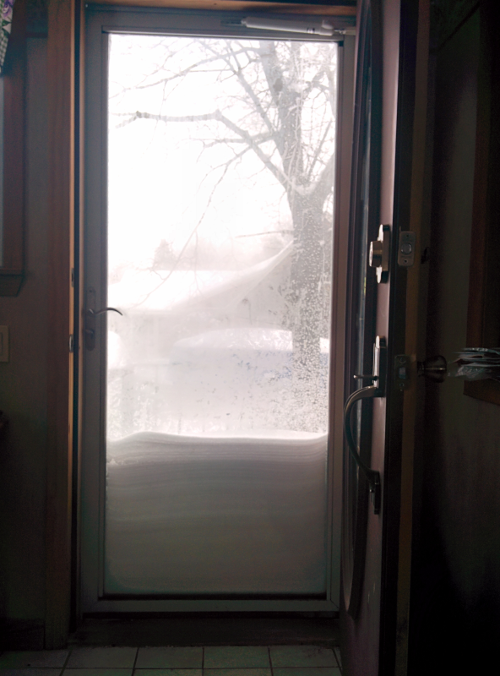 snow piled up on our door